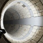 Industrial Refractory Lining installation inside a high-temperature rotary kiln.