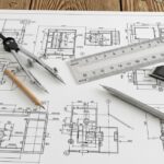 Detailed engineering blueprint showing different types of technical drawing lines with drafting tools.