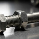 High-resolution close-up of a steel hex bolt and nut on an industrial metallic background