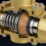 Cutaway 3D render of a brass pressure regulator showing internal spring and diaphragm