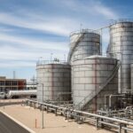 Large welded steel aboveground storage tanks designed to API 650 standard at an industrial facility.
