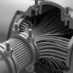 Close-up engineering view of collar bolts installed on a heat exchanger tubesheet during bundle removal operations.