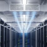 Modern data centre aisle with cold-aisle containment and precision cooling infrastructure for high-density server racks.