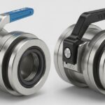 Close-up view of industrial Elaflex and Todo hose couplings showing locking mechanisms and stainless steel construction for chemical transfer.