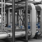 Industrial parallel pipelines on a steel rack showing proper pipe spacing clearance.