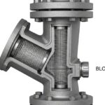 Industrial Y-type piping strainer installed in a high-pressure steel pipeline with visible flanged connections and blow-off valve.