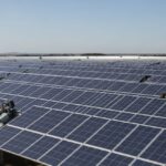 Utility-scale solar farm with horizontal single-axis solar tracking systems aligned for maximum sunlight capture.