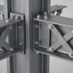 3D render of a structural steel cross-bracing connection with a gusset plate.