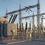 Technical view of a wind farm substation connecting wind turbines to the high-voltage electrical transmission grid.